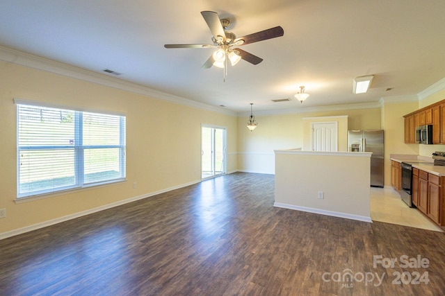 unfurnished living room with hardwood / wood-style flooring, ceiling fan, and crown molding