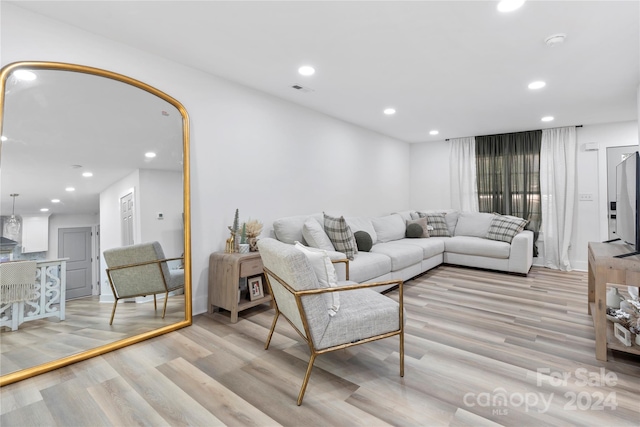 living room with light hardwood / wood-style floors