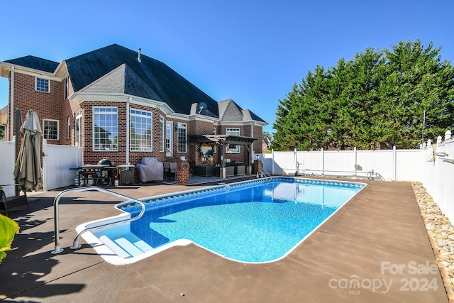 view of swimming pool with a patio area