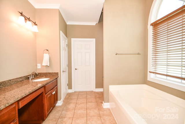 bathroom featuring vanity, a tub, tile patterned flooring, and ornamental molding