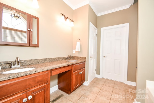 bathroom with vanity, crown molding, and tile patterned flooring