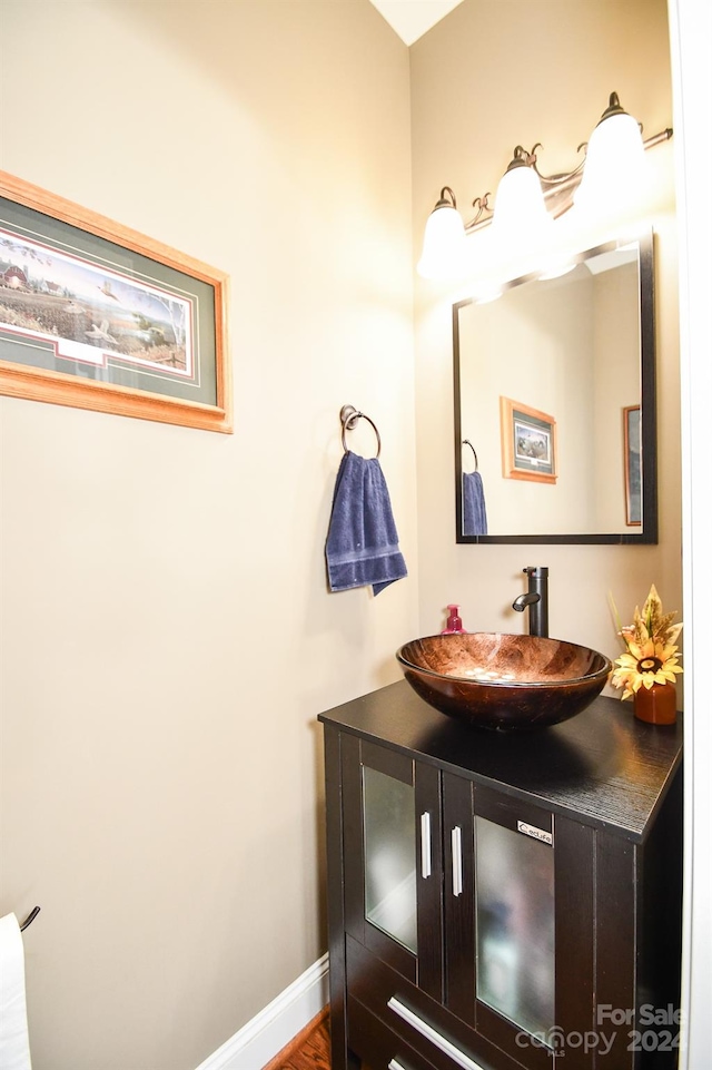 bathroom featuring vanity and hardwood / wood-style floors