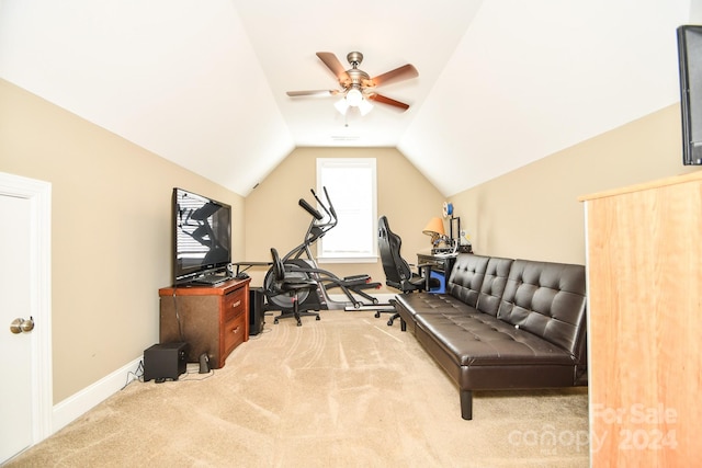 exercise room featuring vaulted ceiling, carpet flooring, and ceiling fan