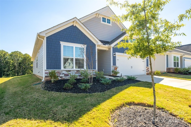 craftsman-style house with a front yard and a garage