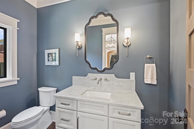 bathroom with vanity and toilet