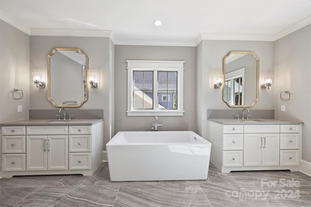 bathroom with a washtub, vanity, and crown molding