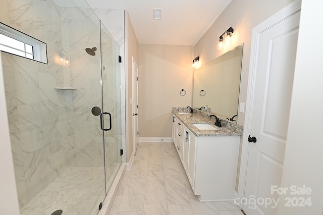 bathroom featuring vanity and a shower with shower door