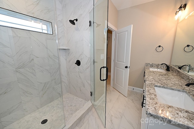 bathroom featuring vanity and a shower with door