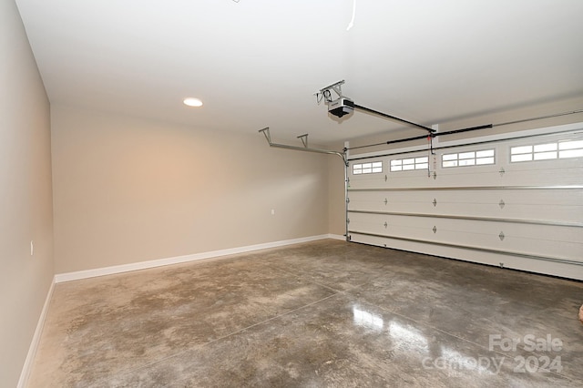 garage featuring a garage door opener