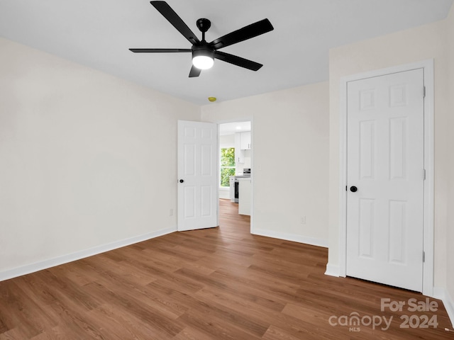 empty room featuring ceiling fan and wood-type flooring