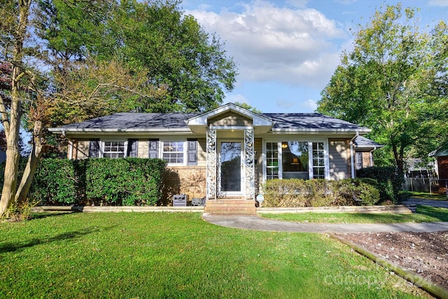 ranch-style home with a front yard