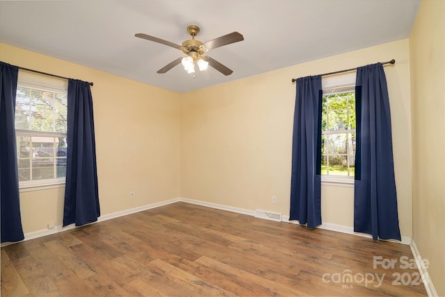 spare room featuring ceiling fan and wood-type flooring