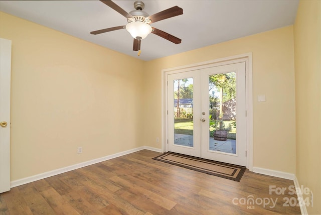 doorway to outside featuring hardwood / wood-style floors, ceiling fan, and french doors