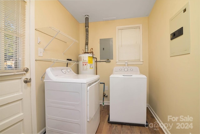 laundry room with hardwood / wood-style flooring, washer and dryer, gas water heater, and electric panel