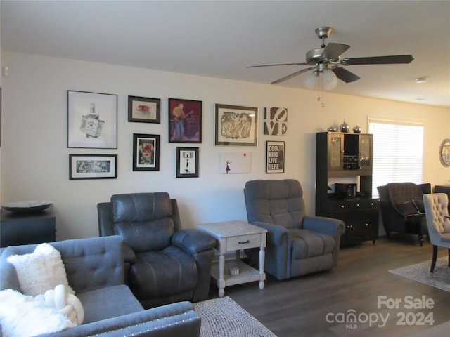 living room with hardwood / wood-style floors and ceiling fan