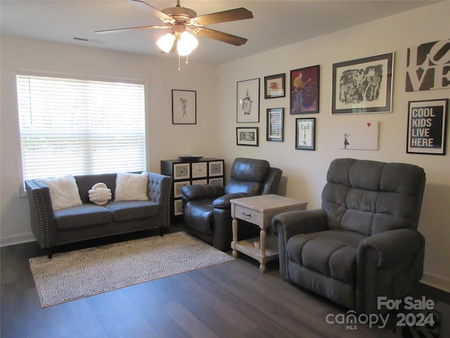 living room with hardwood / wood-style floors and ceiling fan