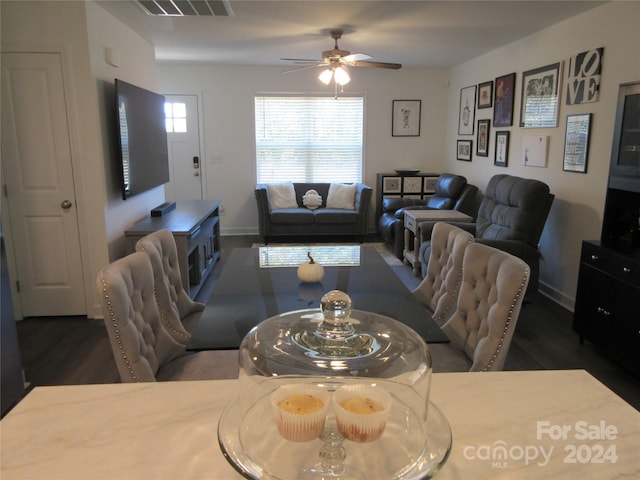 dining room featuring dark wood-type flooring and ceiling fan