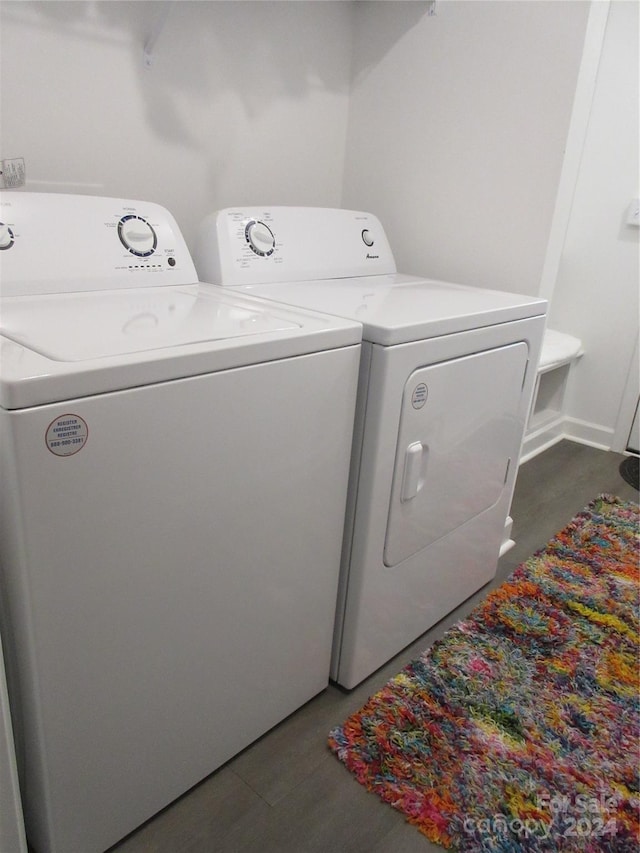 clothes washing area featuring washing machine and clothes dryer