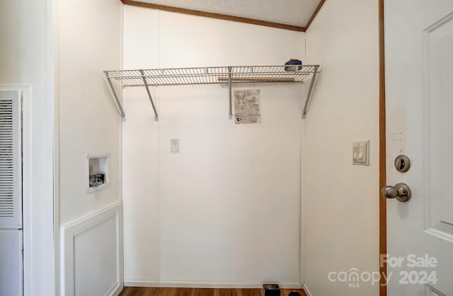 washroom featuring hardwood / wood-style flooring and a textured ceiling