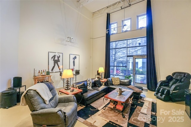 living room with a towering ceiling