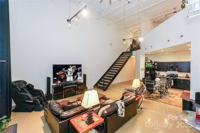 living room with a towering ceiling