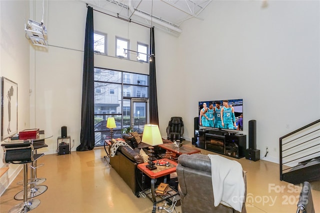 living room with a high ceiling