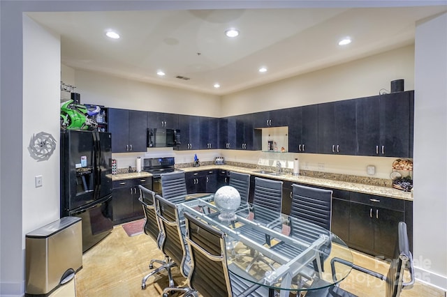 kitchen featuring sink and black appliances