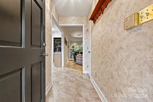 interior space with a textured ceiling