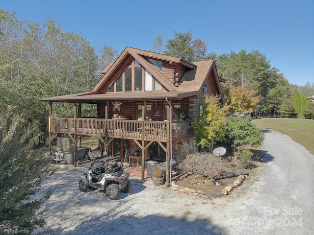 view of front of house with a wooden deck