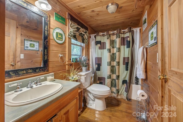 full bathroom featuring hardwood / wood-style floors, shower / bath combination with curtain, toilet, wooden ceiling, and vanity