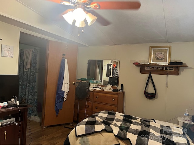 bedroom featuring lofted ceiling, hardwood / wood-style flooring, and ceiling fan