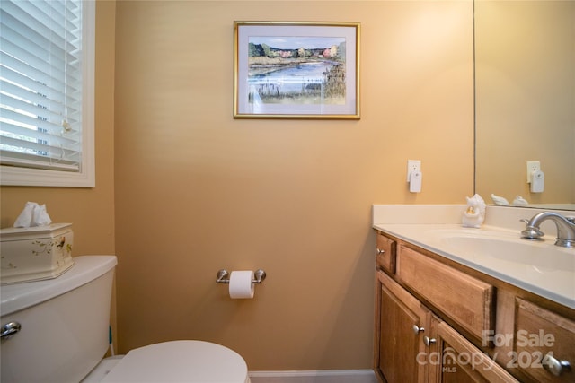 bathroom with vanity and toilet