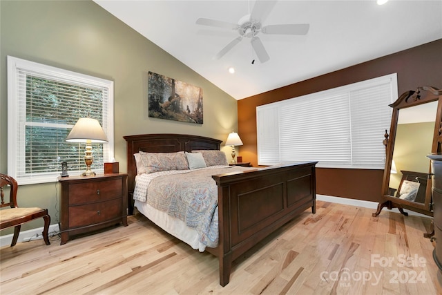 bedroom with lofted ceiling, light wood-type flooring, and ceiling fan