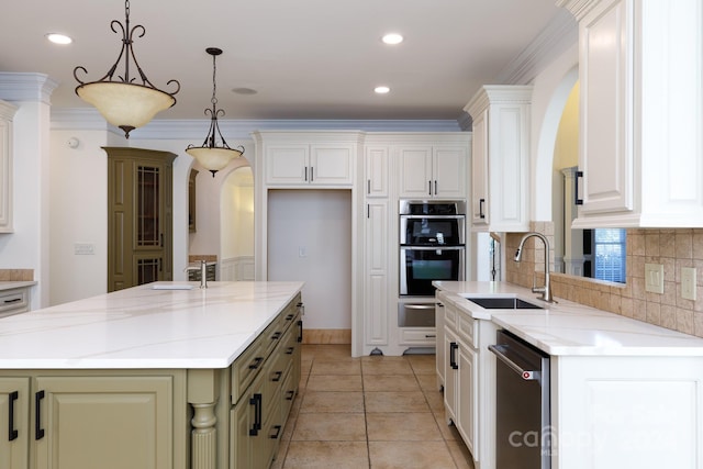 kitchen with crown molding, a center island, and light stone counters