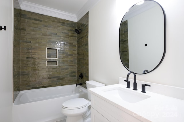 full bathroom featuring vanity, crown molding, tiled shower / bath combo, and toilet