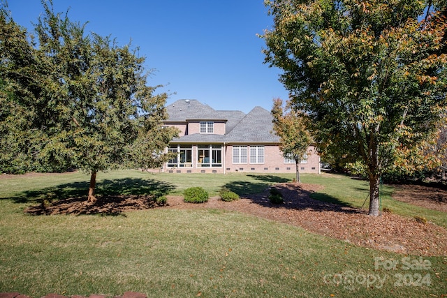 view of front of house with a front yard