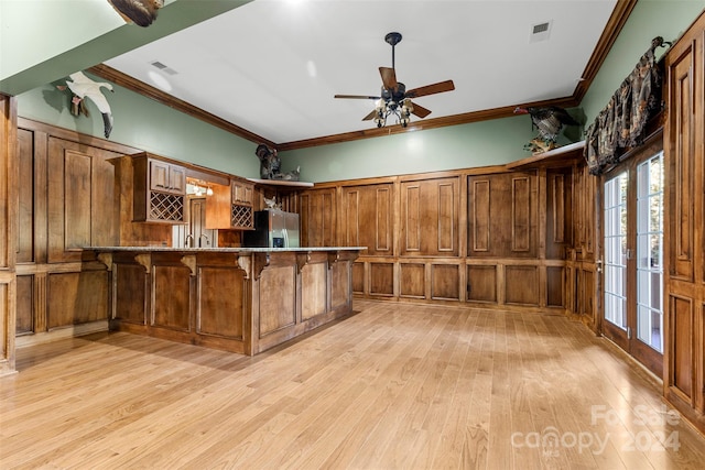 kitchen with a kitchen bar, kitchen peninsula, light hardwood / wood-style floors, and stainless steel refrigerator with ice dispenser