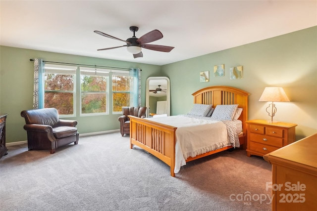 bedroom with carpet floors, a ceiling fan, and baseboards