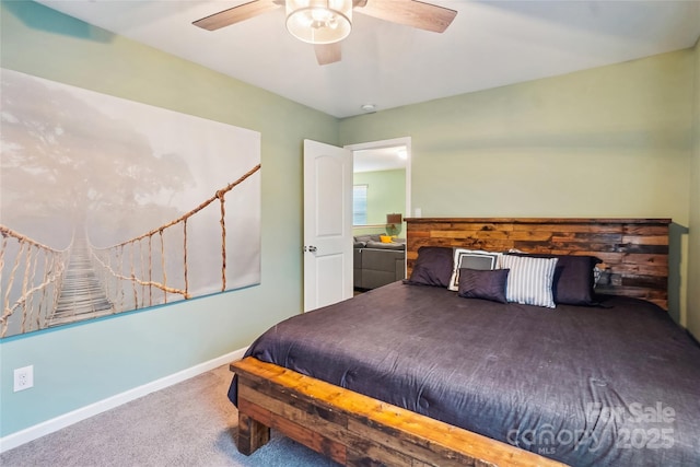 carpeted bedroom featuring a ceiling fan and baseboards