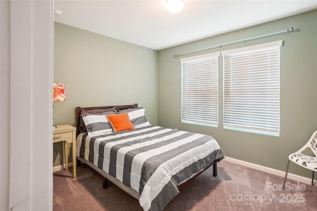 carpeted bedroom with baseboards