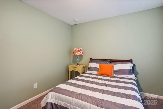 carpeted bedroom featuring baseboards