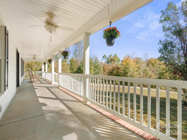 view of patio featuring ceiling fan and a porch