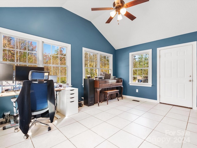 tiled home office with ceiling fan and vaulted ceiling