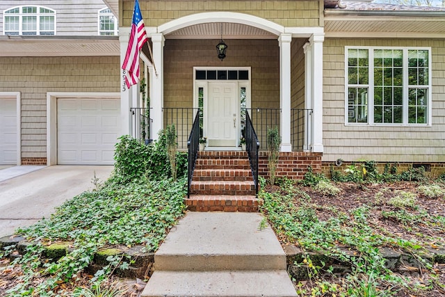 view of exterior entry featuring a garage