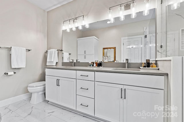 bathroom featuring vanity, toilet, and an enclosed shower