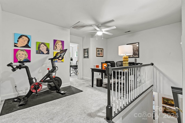 exercise area featuring carpet flooring and ceiling fan