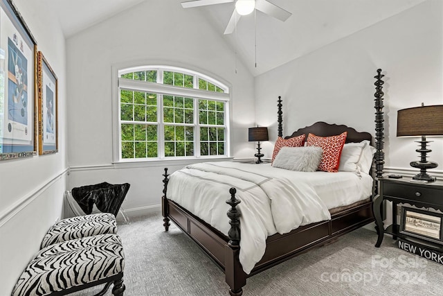 carpeted bedroom featuring lofted ceiling and ceiling fan