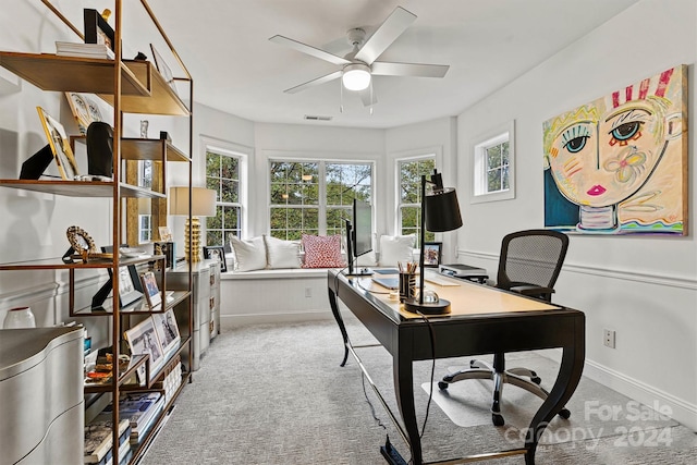 office area with carpet and ceiling fan