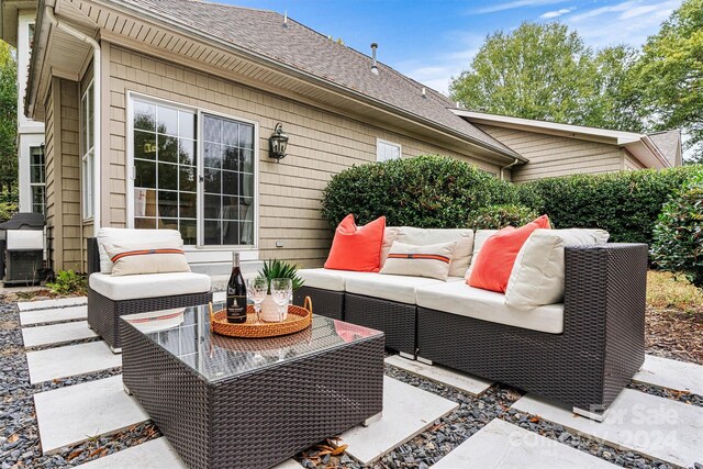 view of patio with outdoor lounge area and a grill