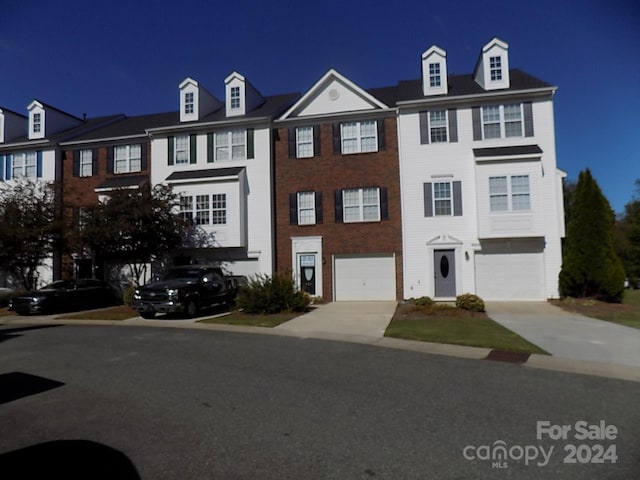 141 Rock Ridge Ln, Mount Holly, NC 28120 - townhome / multi-family property featuring driveway and a garage